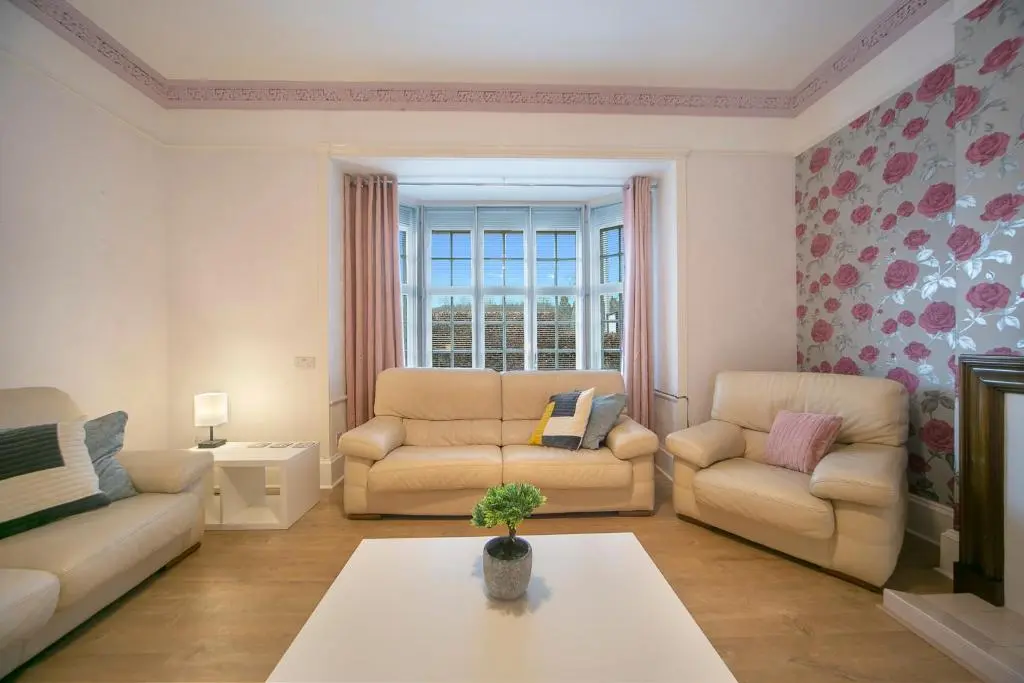 a living room with two couches and a table at Constancevilla B8 - Grampian Lettings Ltd in Aberdeen