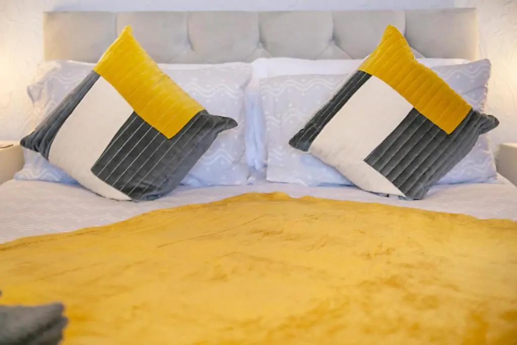 two pillows sitting on top of a bed at Constancevilla B8 - Grampian Lettings Ltd in Aberdeen