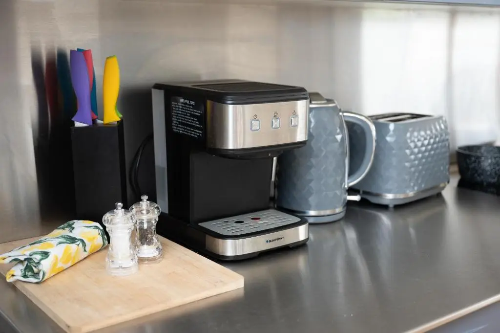 a coffeemaker sitting on a kitchen counter with a coffee maker at Stunning Rural Retreat Sleeps\u00a024 in Aberdeen