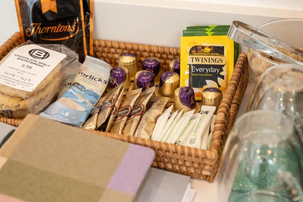 a basket filled with different types of food at Nana Cottage , Findhorn Village in Findhorn