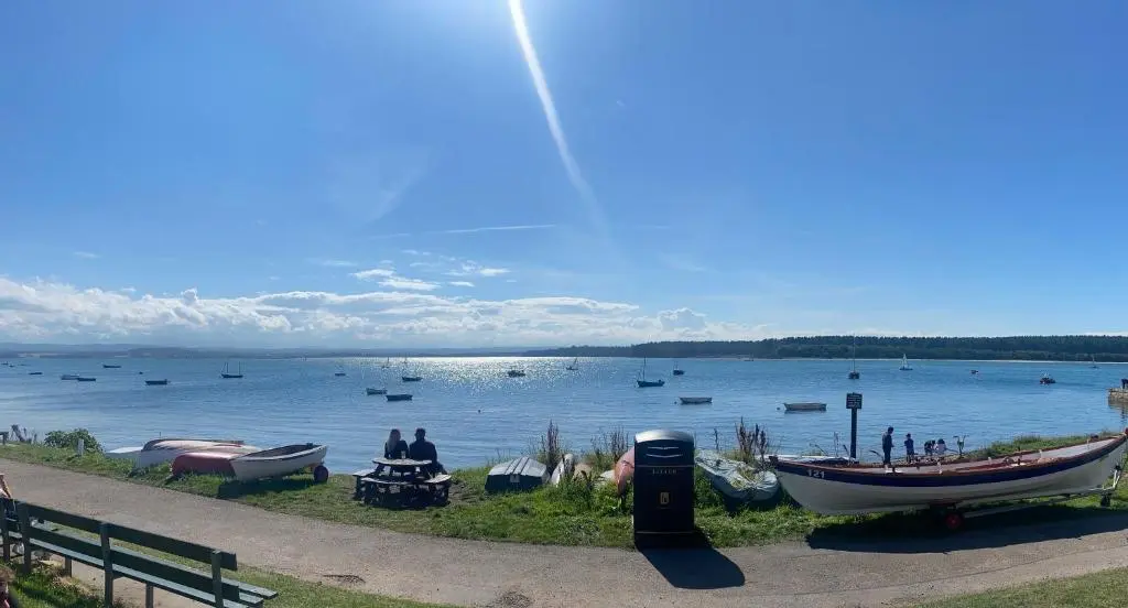 a large body of water with boats on it at Nana Cottage , Findhorn Village in Findhorn
