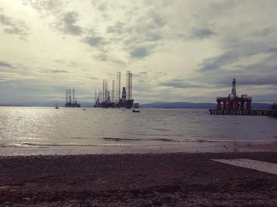 a large body of water with cranes in the distance at Applegrove, perfect 2 bed bungalow, Fortrose in Fortrose