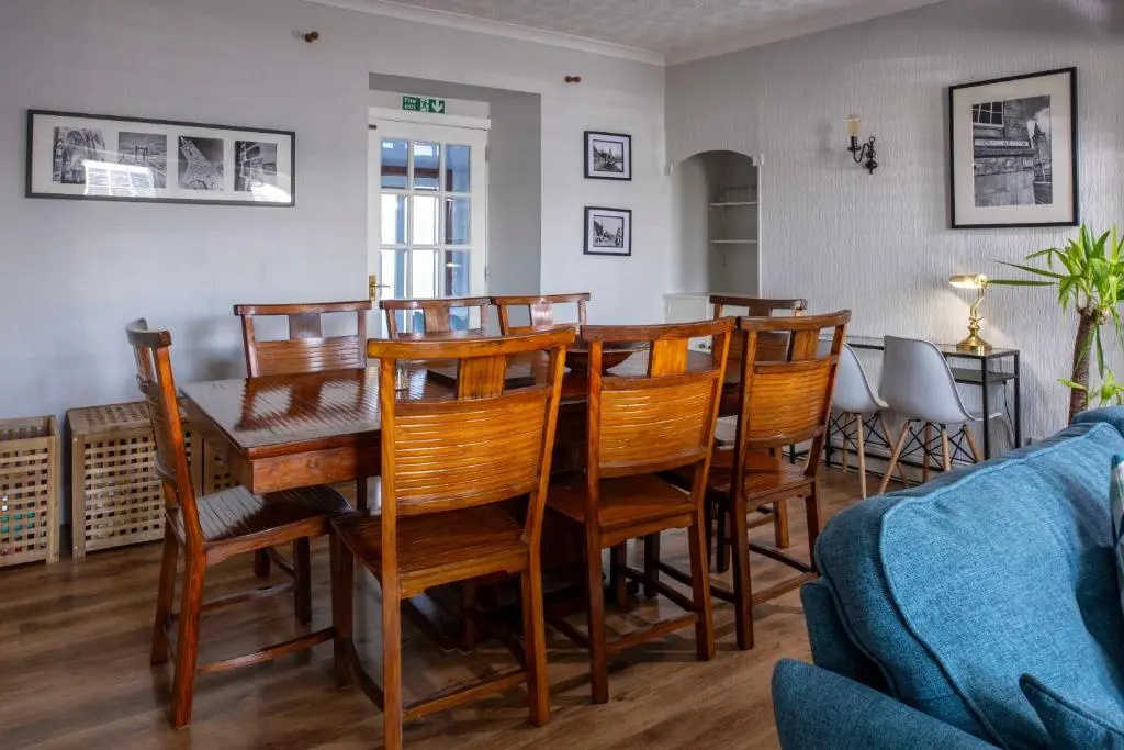 a dining room with a table and chairs at River View City Centre- Free Parking in Inverness