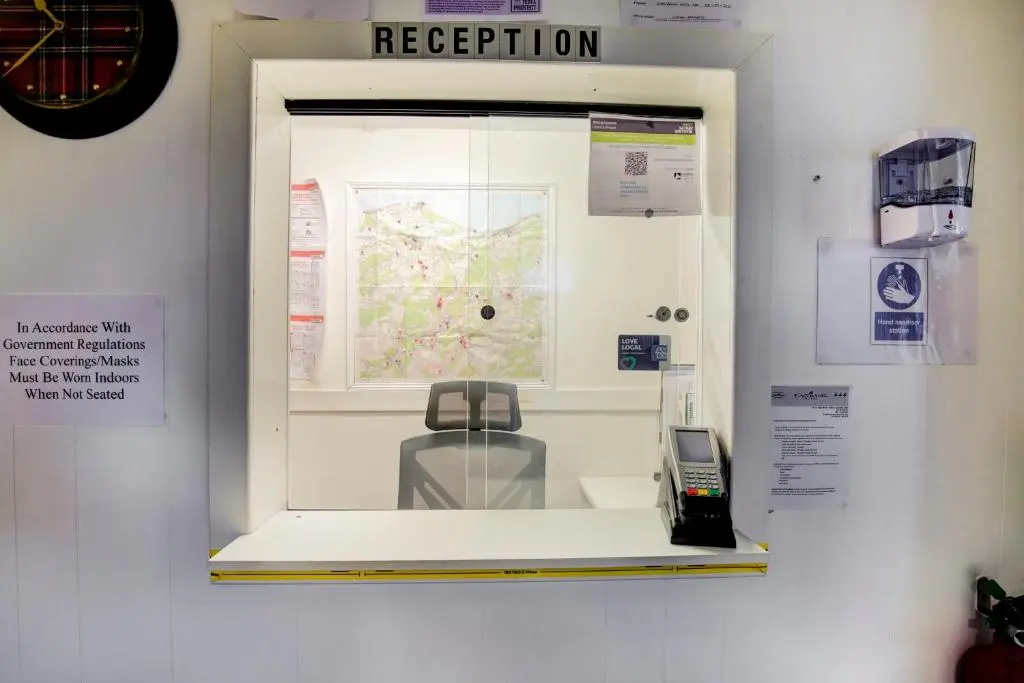 a display case with a cell phone in a museum at OYO Eastbank Hotel, Speyside Scotland in Rothes