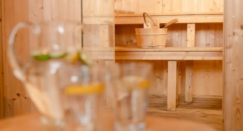 a glass cup sitting on a table in a kitchen at Salmon Run Lodge in Carrbridge