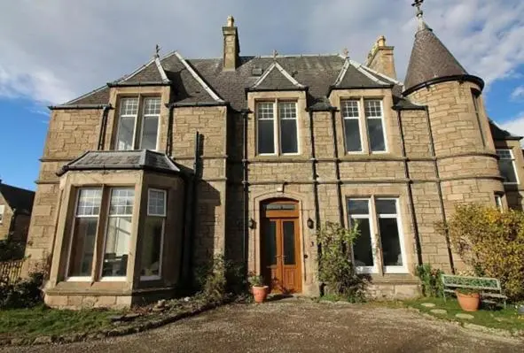 an old brick house with at Duchally House in Nairn