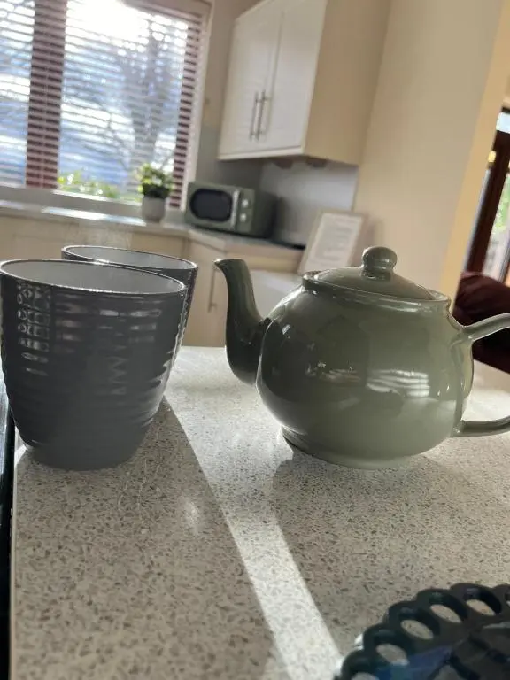 a tea pot sitting on top of a kitchen counter at The Lodge at Woodend in Kemnay