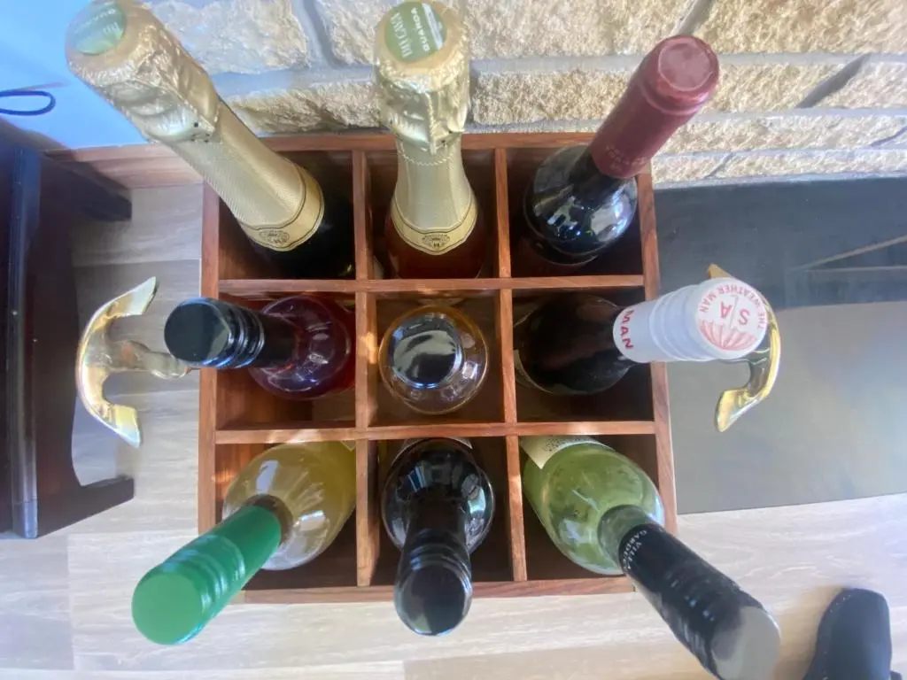 a bunch of wine bottles in a wine rack at Drummond House - Pets welcome free, 3 acres of gardens, free parking in Brackley