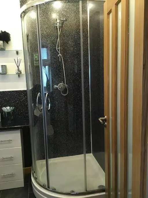 a shower with a glass door in a bathroom at Bonnie Bide Huntly Aberdeenshire in Huntly