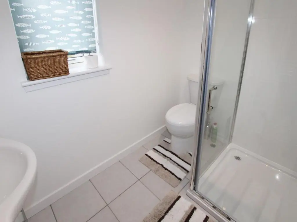 a bathroom with a shower and a toilet at The Townhouse in Inverness