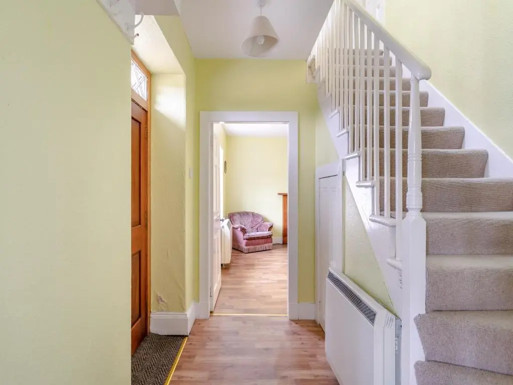 a hallway with stairs in a house at Meall Darroch in Inverey