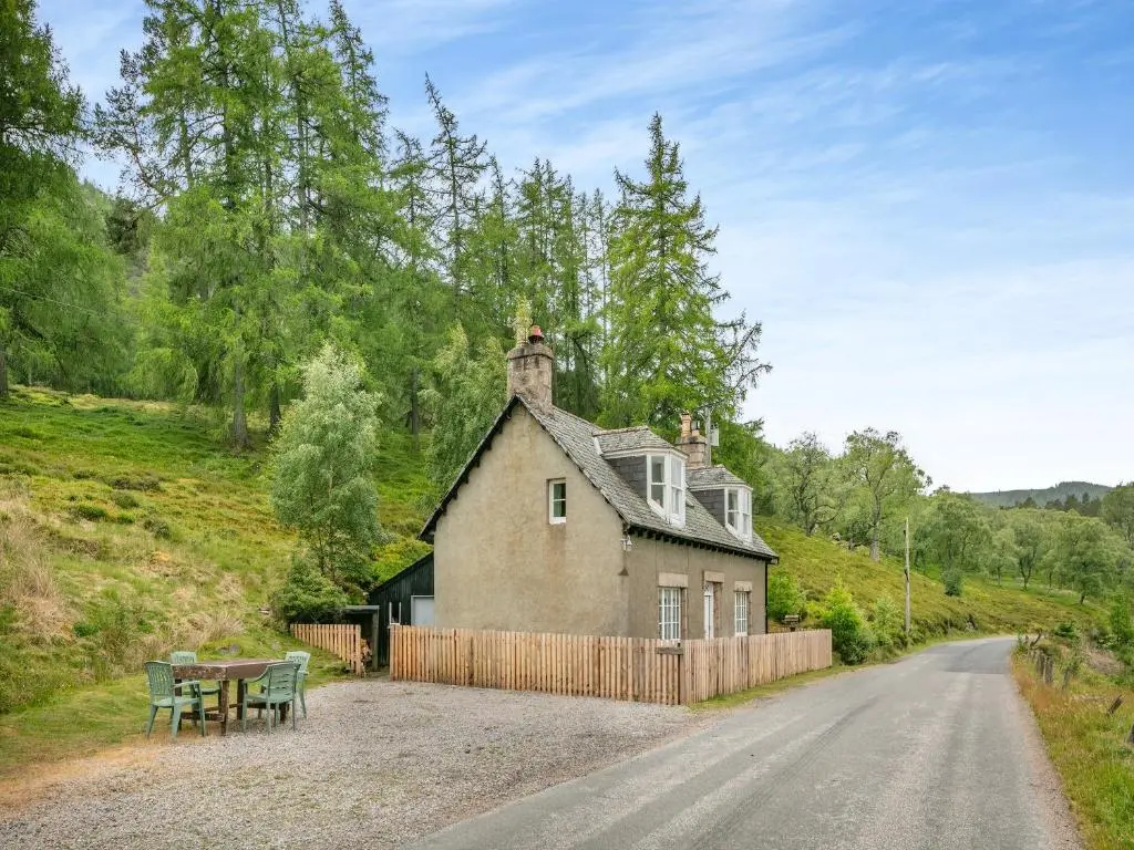 an old house on the side of a road at Meall Darroch in Inverey