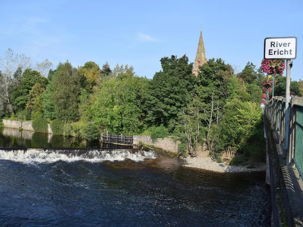 a river with a sign that reads river eight at The White House in Pitlochry
