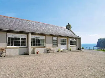 a house with a view of the ocean at Pennan Lodge - 26818 in Pennan