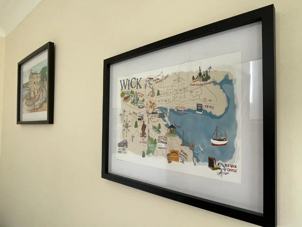 a framed map of wicks on a wall at Impala Guest House in Wick