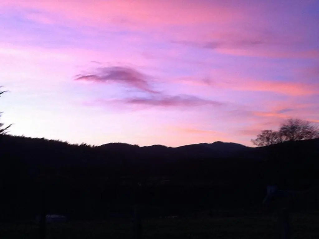 a sunset with a purple and pink sky at Holiday Home Lochness by Interhome in Contin