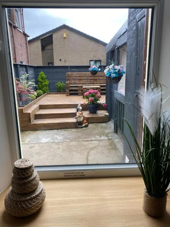 a view of a patio from a sliding glass door at 51 Innes Street Apartment in Inverness