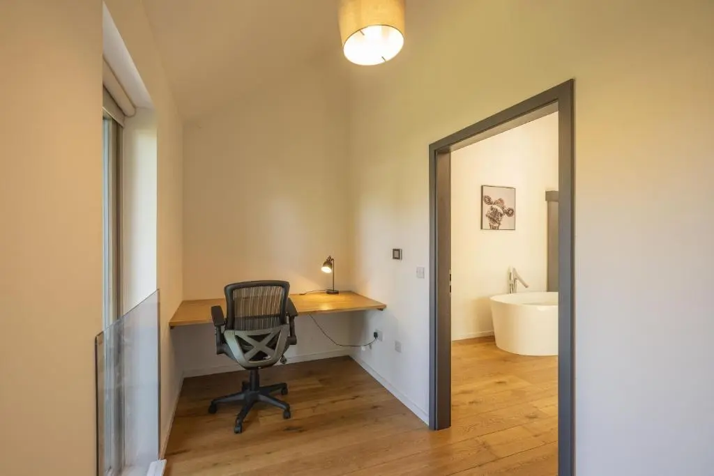 an office with a desk and a chair in a room at The Neuk in Kincraig