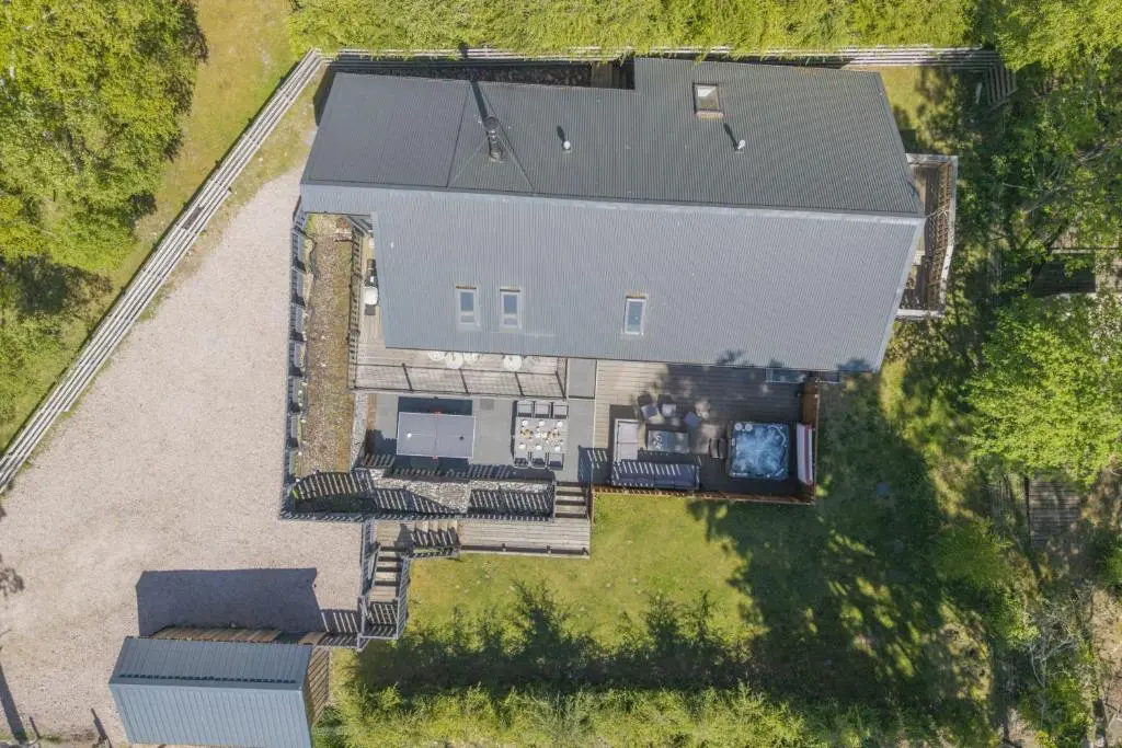 an overhead view of a house with a yard at The Neuk in Kincraig