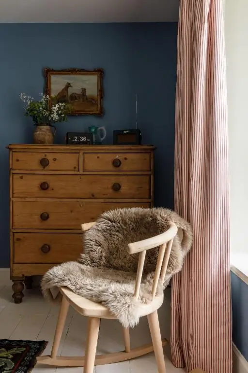 a room with a chair and a dresser with a curtain at Exclusive use - The Coach House in Banchory