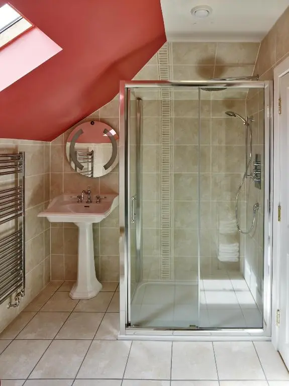 a bathroom with a shower and a sink at Tali Ayer in Nairn