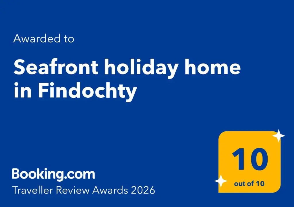 a yellow sign with the text advent holiday home in find eligibility at Seafront holiday home in Findochty in Findochty