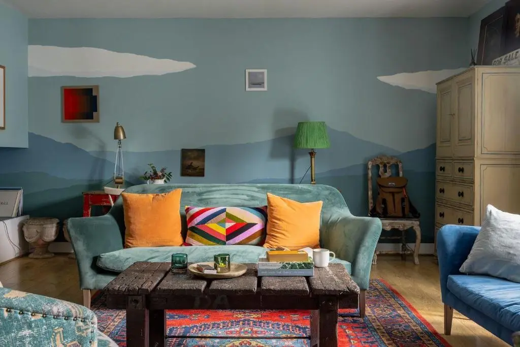 a living room with a couch and a table at The Corner House in Banchory