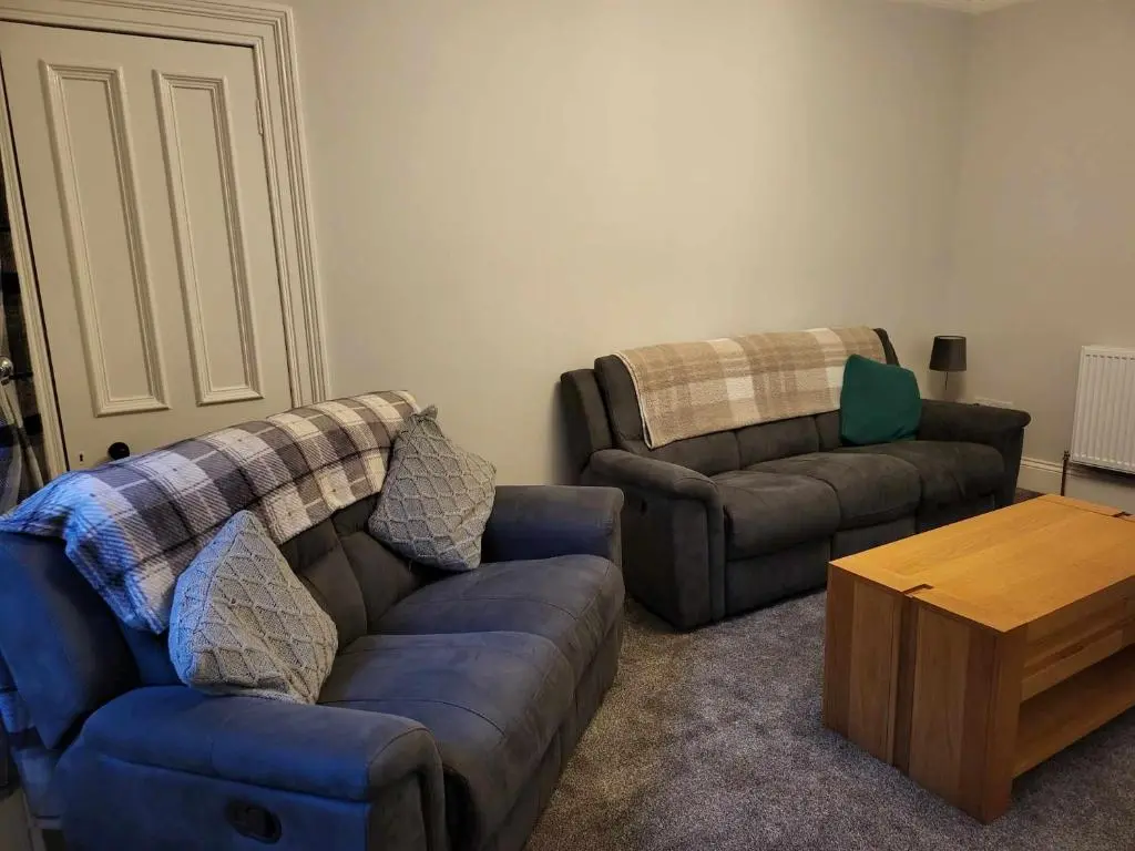 a living room with two couches and a coffee table at 16 Northcote Street, Wick in Wick