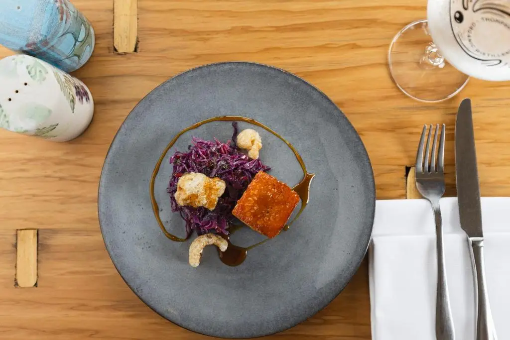 a plate of food on a table with a fork and knife at Dornoch Castle Hotel in Dornoch