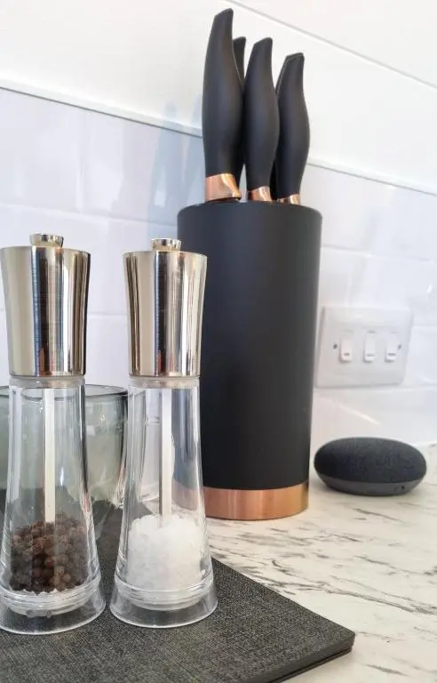 two glass vases sitting on a counter with some food at Bombie Glamping Pod in Grantown on Spey
