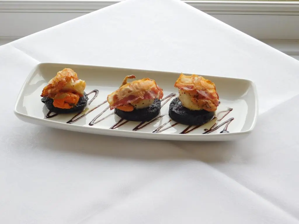 a plate of sushi on a white table at Cullen Bay Hotel in Cullen