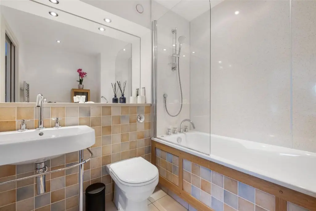 a bathroom with a toilet and a sink and a shower at By the Bridge by Toppo in Inverness