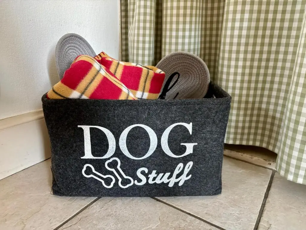 a bag with a dog and a smile written on it at Loch Ness village cottage for 2 with free parking & pets welcome in Drumnadrochit