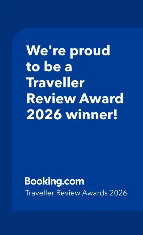 a blue sign that says were proud to be a traveller review award winner at Balormie View in Lossiemouth