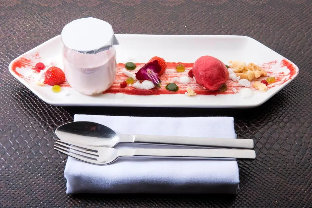 a plate of food on a table with a fork and knife at The Glenmoriston Townhouse Hotel in Inverness