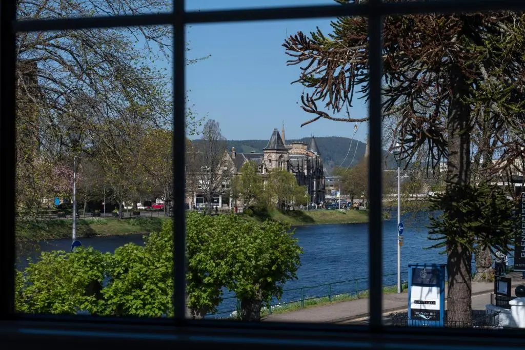 a view of a lake from a window at The Glenmoriston Townhouse Hotel in Inverness