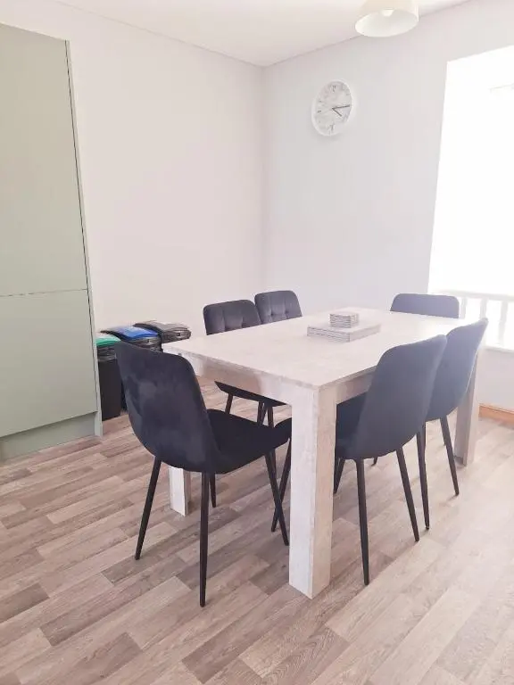 a conference room with a table and chairs at 3 Bedroom Townhouse on NC500, Wick, Highland in Wick