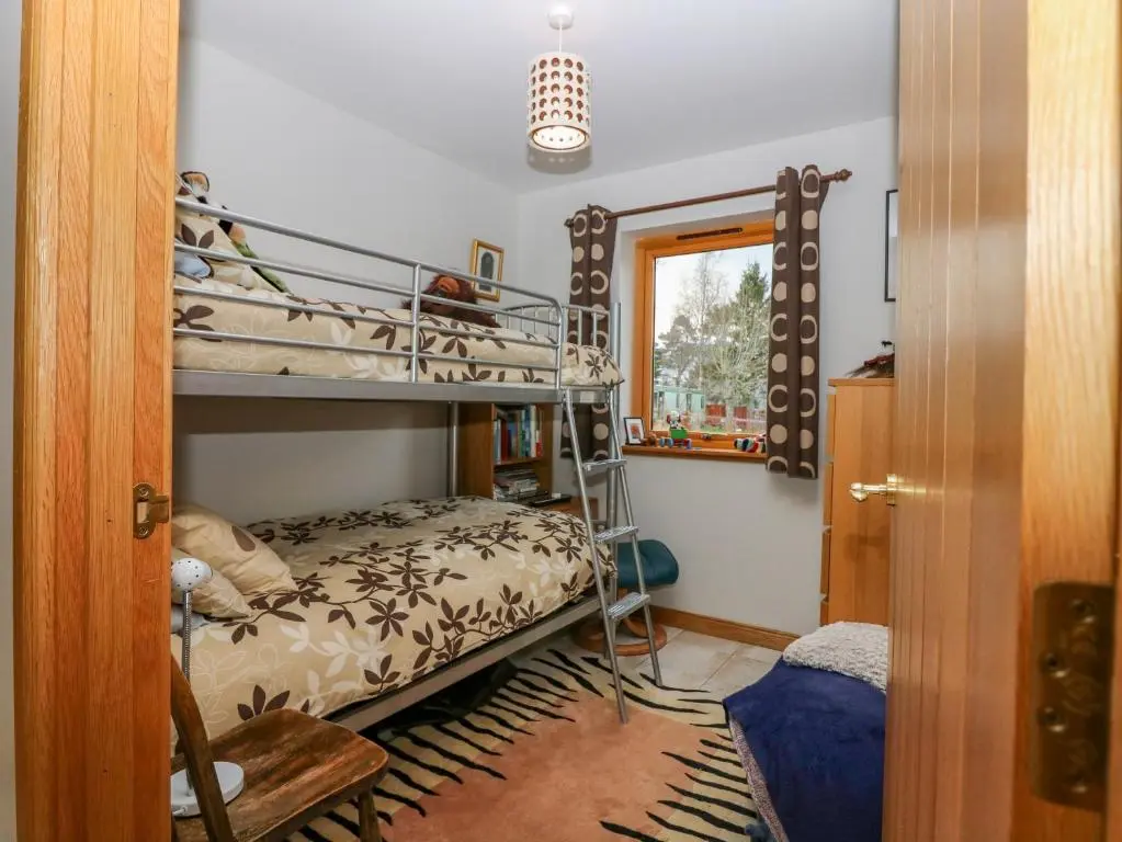 a bedroom with a bunk bed and a bunk bed at Otakaro in Tomintoul