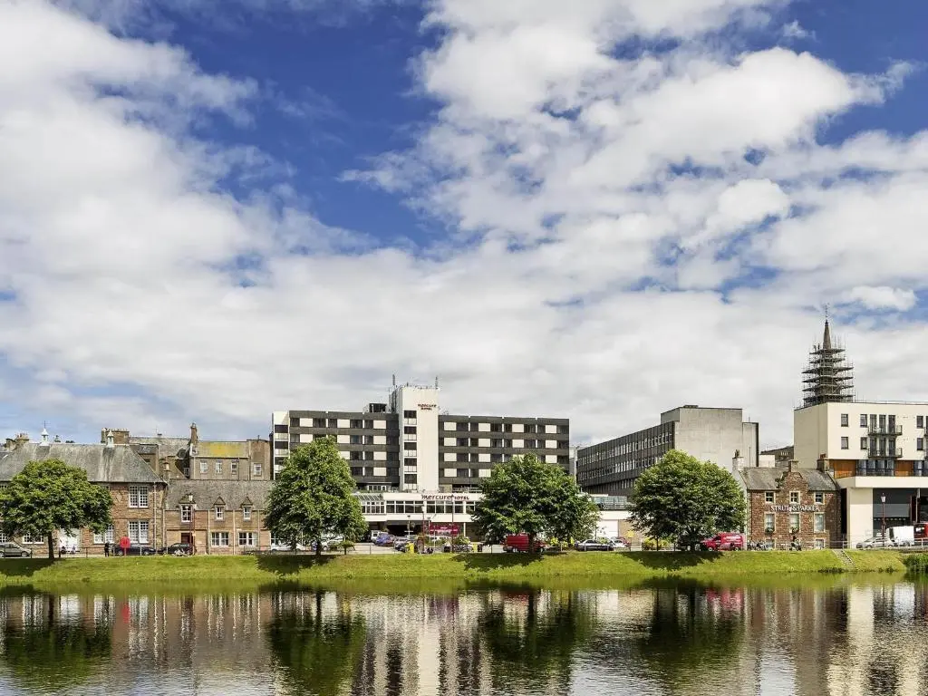 a city with buildings and a body of water at Mercure Inverness Hotel in Inverness