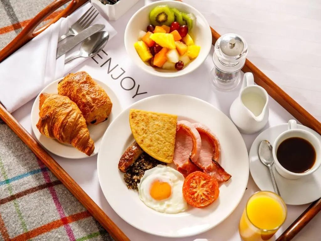 a tray of breakfast foods on a table at Mercure Inverness Hotel in Inverness