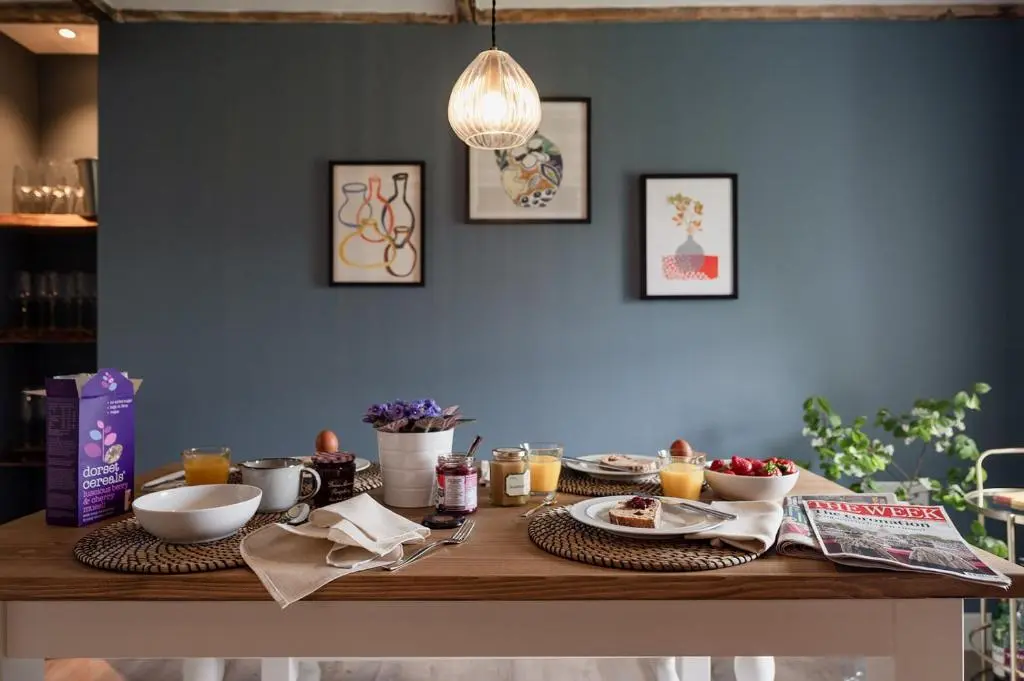 a wooden table with food on top of it at Gleann Cottage - Seasgair Lodges in Kincraig