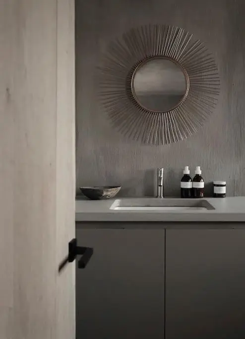 a bathroom with a sink and a mirror at Inverenzie Cottage, Rooms with a view! in Coilacriech