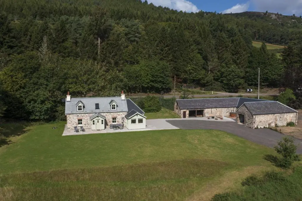 an aerial view of a house in the mountains at Middleton Farmhouse in Inverness