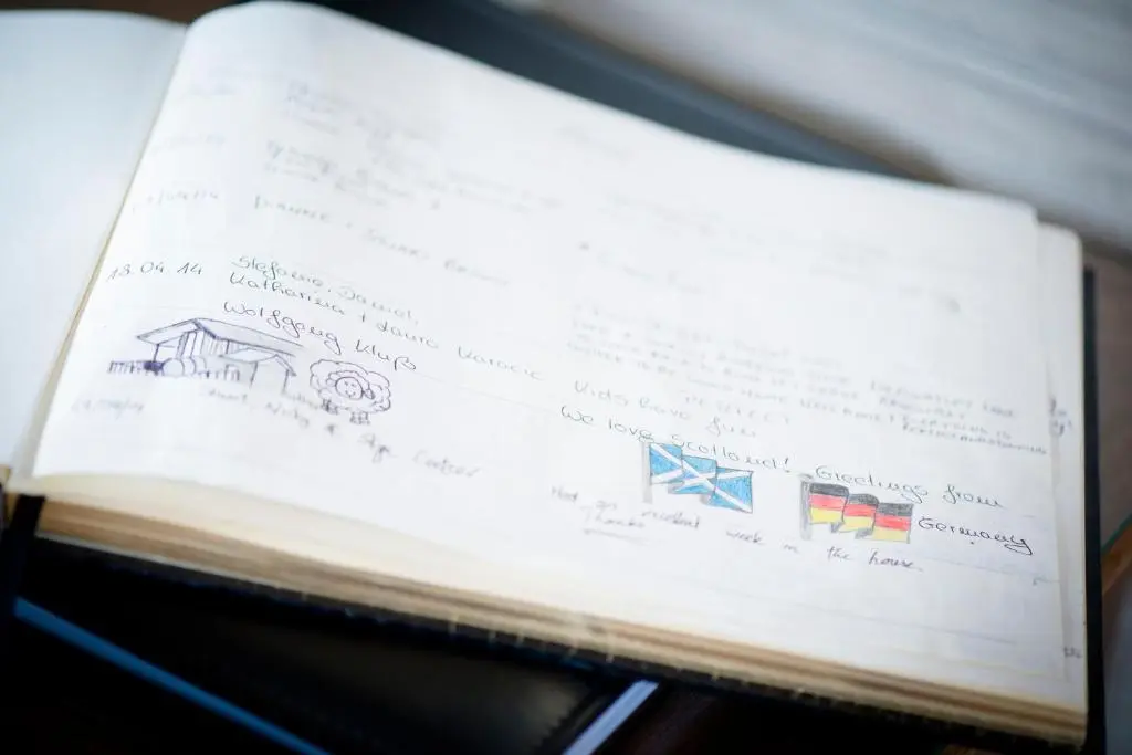 a book with a drawing of flags on it at Aurae in Nairn