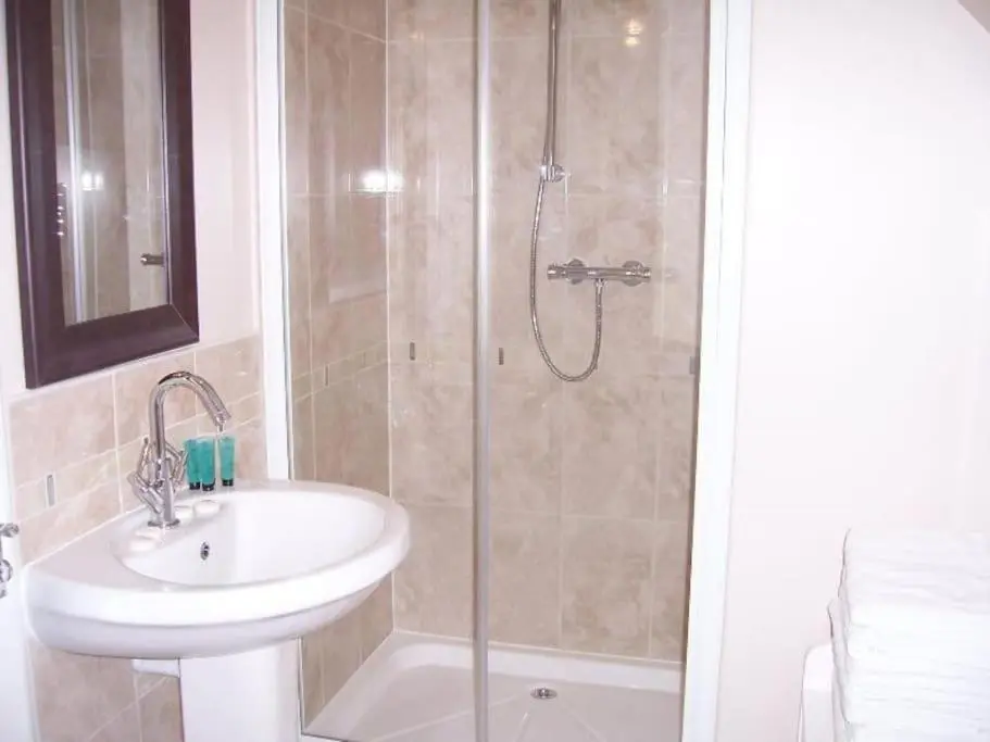 a bathroom with a shower and a sink and a shower at Cardon House - luxury Highland holiday home in Inverness