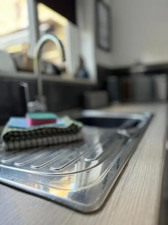 a metal tray with a sink and a faucet at Cullen Holiday Home in Cullen