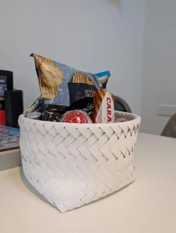 a white basket sitting on top of a table at Cullen Holiday Home in Cullen