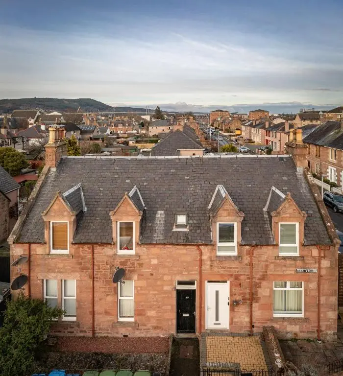 an aerial view of a brick house with a roof at Sweet Ness River Flat in Inverness