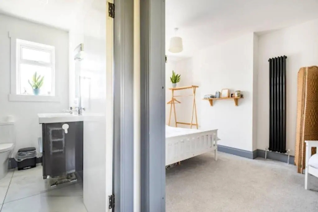 a bathroom with a sink and a bath tub at Cosy Hygge/ Scottish themed home by Loch Ness in Fort Augustus