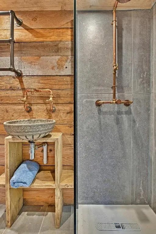 a bathroom with a shower and a sink at Finest Retreats - Cosagach Falls Cabin in Kiltarlty